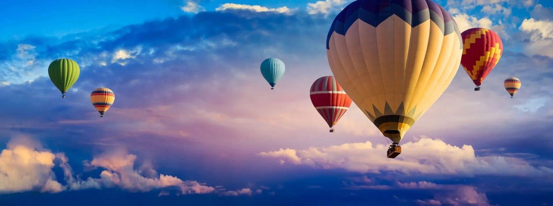 hot-air-balloon-ride-at-sunrise-background-1899938317.jpg